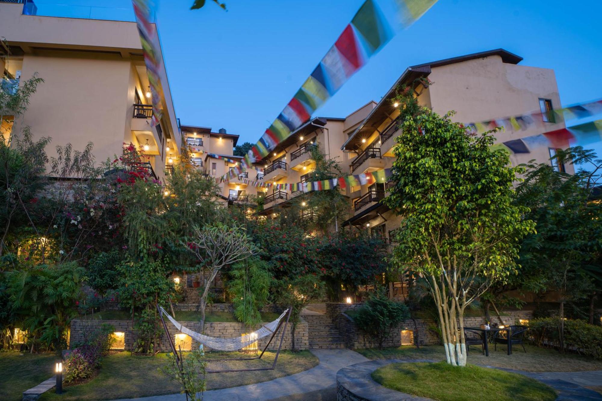 Bar Peepal Resort Pokhara Bagian luar foto The hotel at night