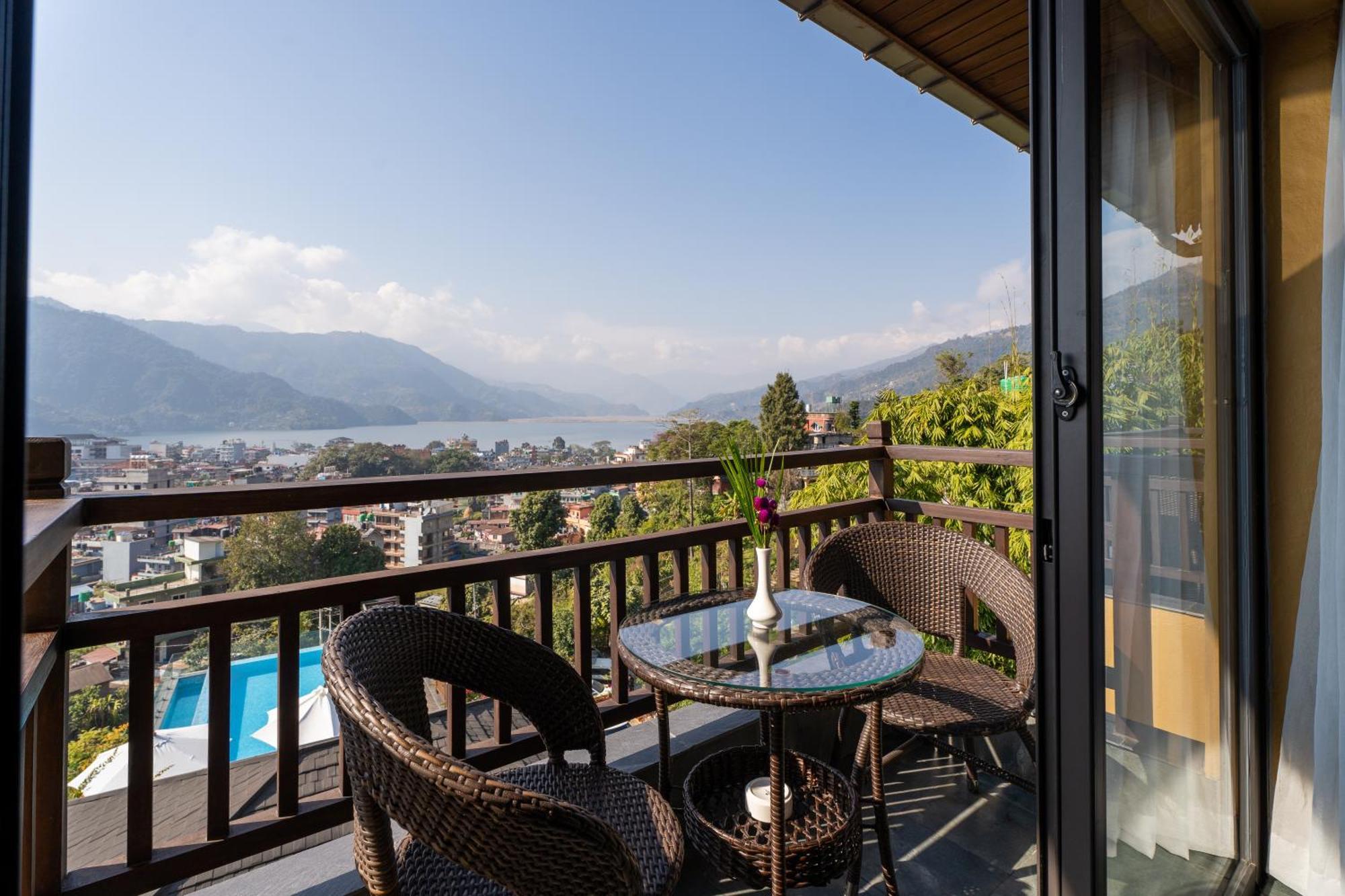 Bar Peepal Resort Pokhara Bagian luar foto A view of Lake Biwa from a guest room